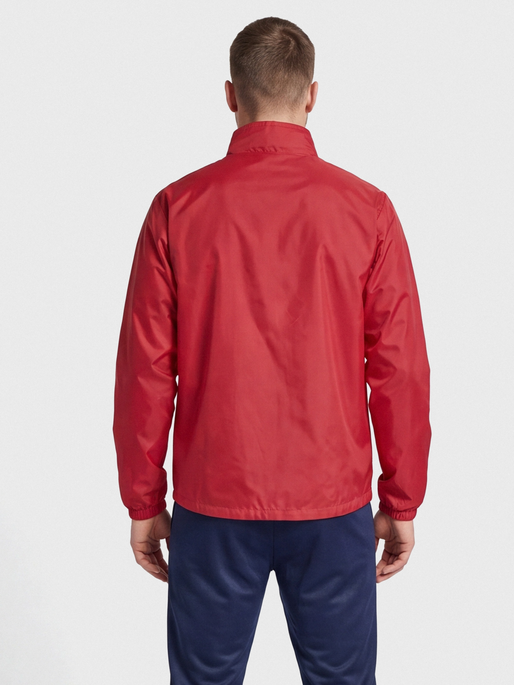 hmlPROMO RAIN JACKET, TRUE RED, model