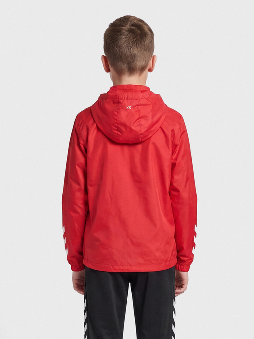 hmlCORE XK SPRAY JACKET KIDS, TRUE RED, model